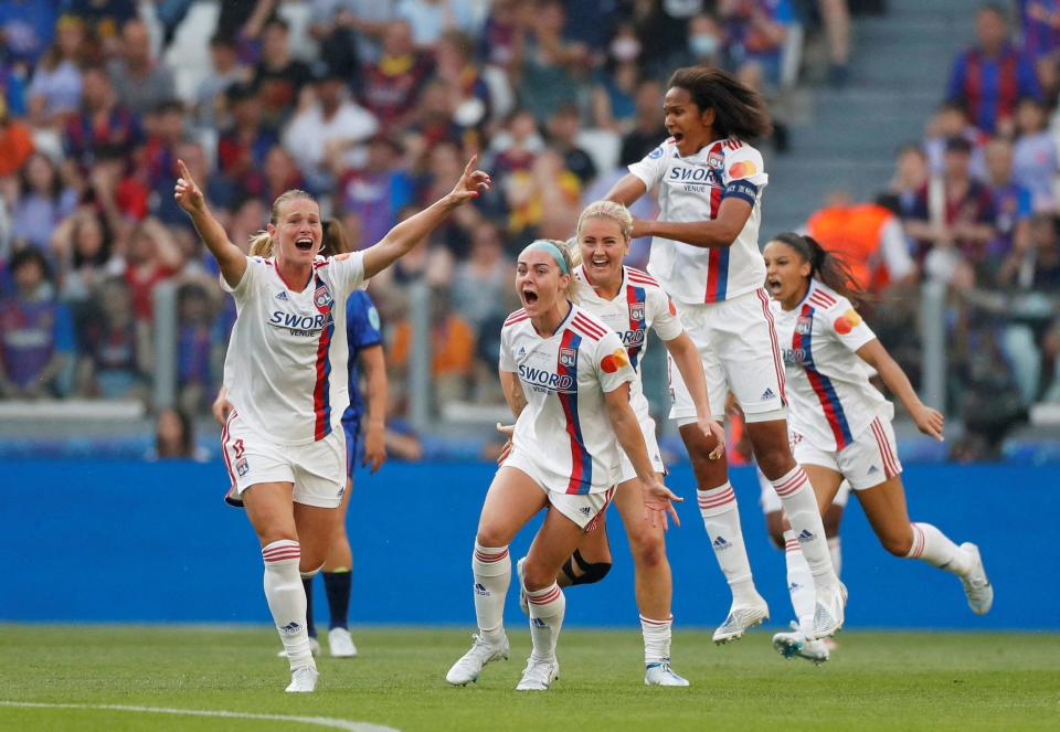 Amandine Henry (left) and her Lyon teammates celebrate her stunning goal during the Champions League final.