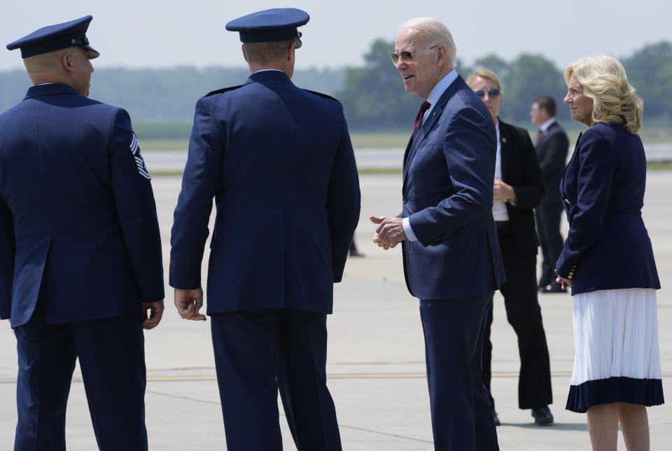 President Joe Biden and first lady Jill Biden greet Chief Master Sgt. Peter Martinez, Command Chief, 4th Fighter Wing, left, and Col. Lucas "Shack" J Teel, Commander, 4th Fighter Wing, second from left, at Seymour Johnson Air Force Base in Goldsboro, N.C., Friday, June 9, 2023. The Bidens are in North Carolina to visit a community college and meet with service members and their families. (AP Photo/Susan Walsh)