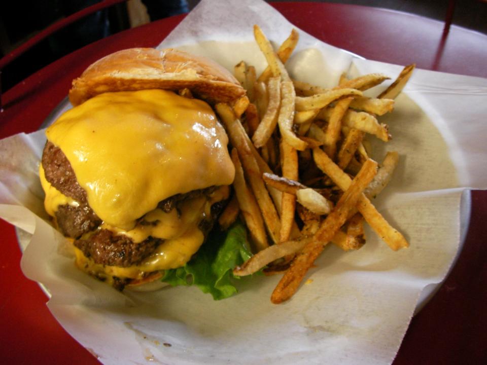 The quad burger (four quarter-pound patties) was an offering at AJ Bombers on Water Street in Milwaukee.