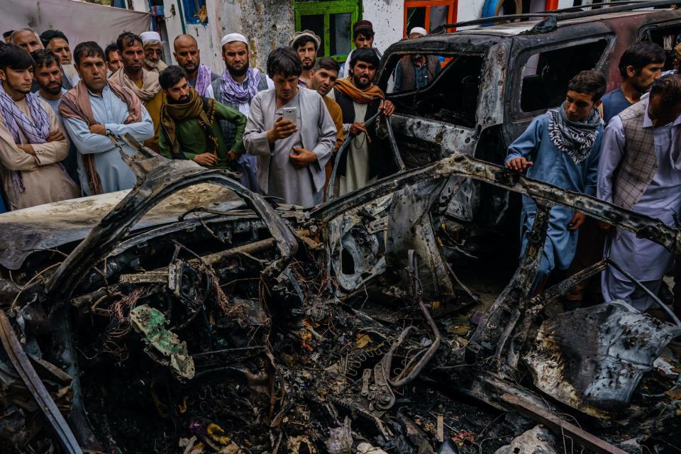 Afghans view aftermath of a US drone strike