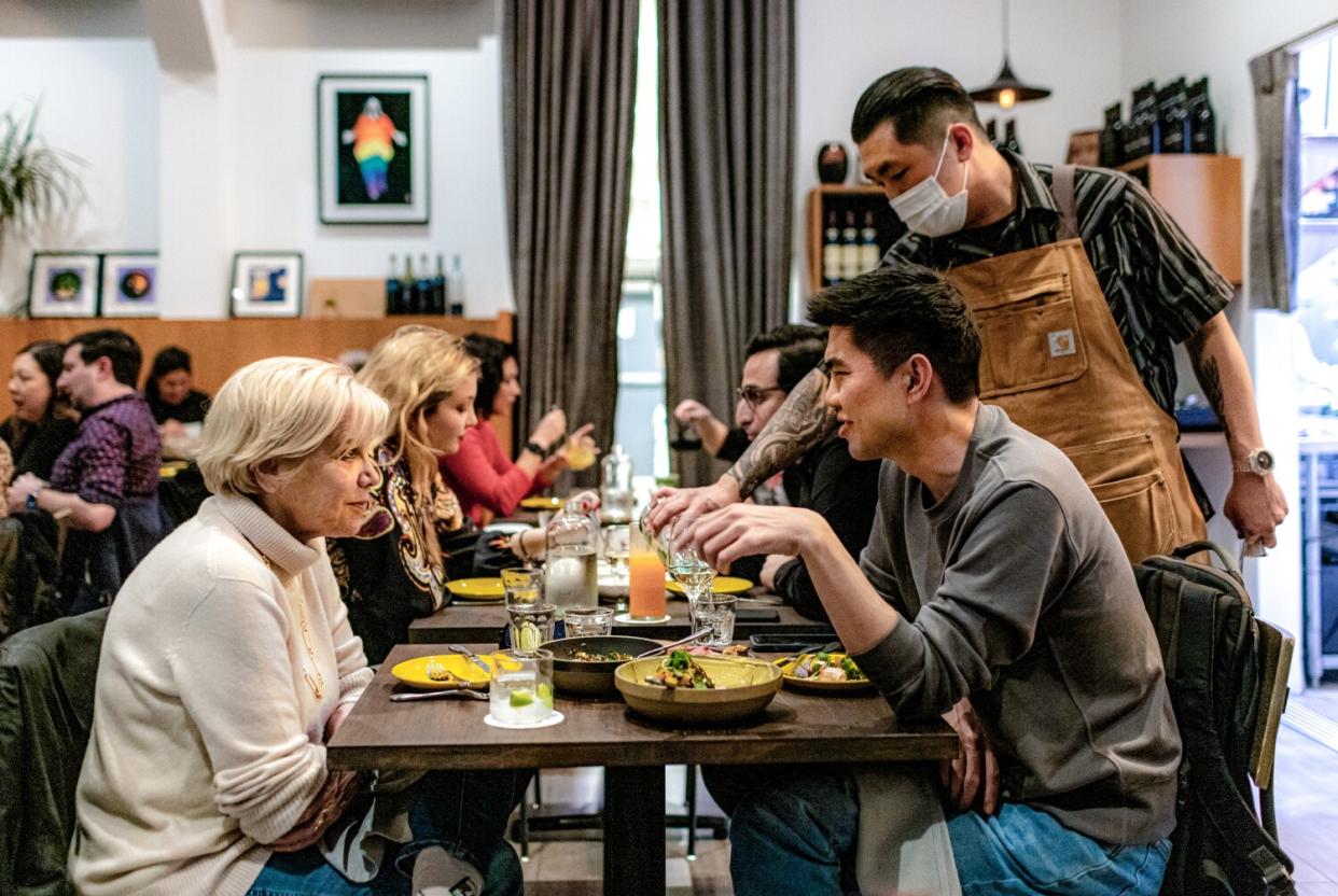 Customers dining at Here's Looking At You restaurant in Los Angeles.