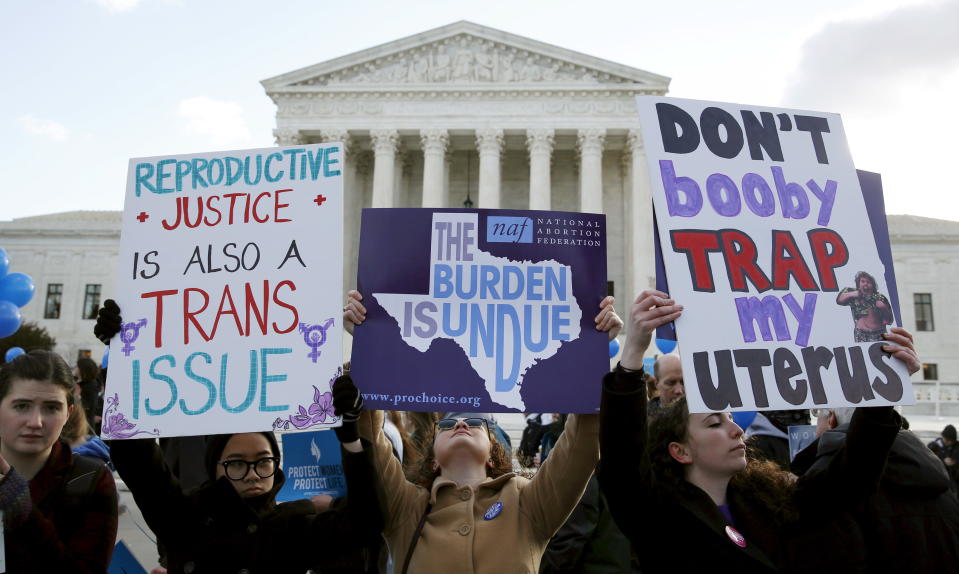 Protesters rally outside Supreme Court on March 2, 2016, as the court took up a major case focused on whether a Texas law imposing strict regulations on abortion doctors and clinic buildings interferes with the constitutional right of women to end pregnancies. (Photo: Kevin Lamarque/Reuters)