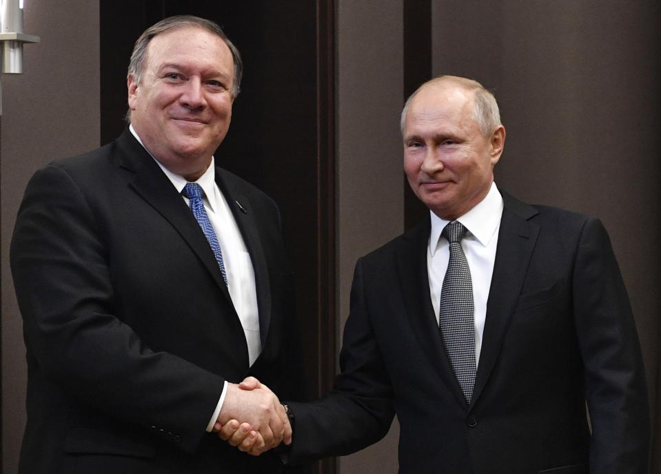 Russian President Vladimir Putin, right, and U.S. Secretary of State Mike Pompeo, pose for a photo prior to their talks in the Black Sea resort city of Sochi, southern Russia, Tuesday, May 14, 2019. Pompeo arrived in Russia for talks that are expected to focus on an array of issues including arms control and Iran. (Alexander Nemenov/Pool Photo via AP)