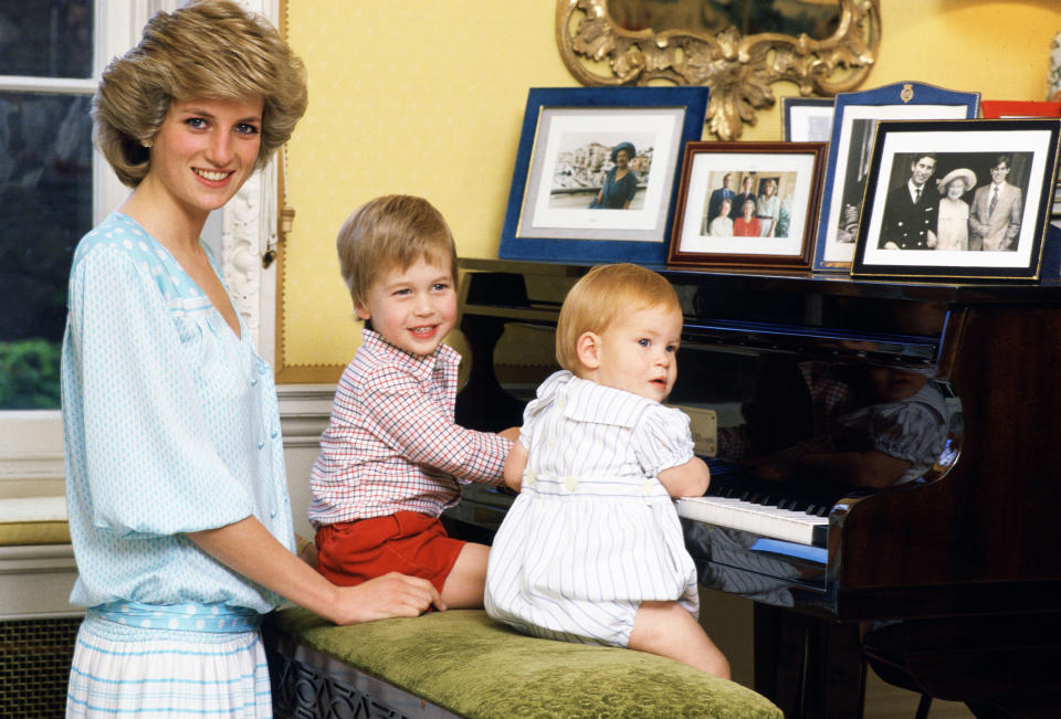 Princess Diana is pictured with her sons, Prince William and Prince Harry, at the piano in Kensington Palace. (Tim Graham/ Getty Images)