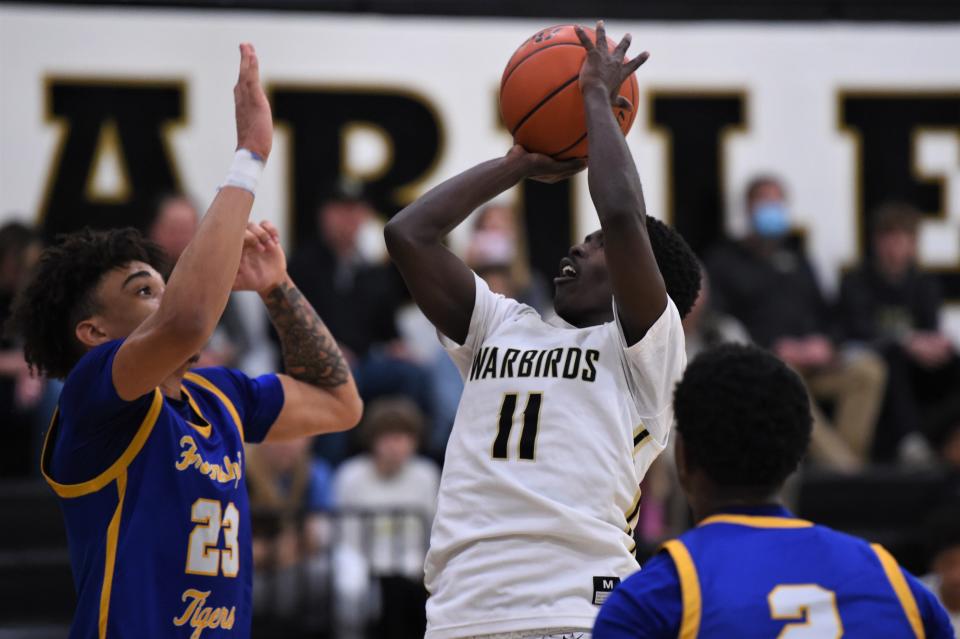 Abilene High's Sami Kanayo (11) goes up for a shot during Tuesday's game against Wolfforth Frenship.