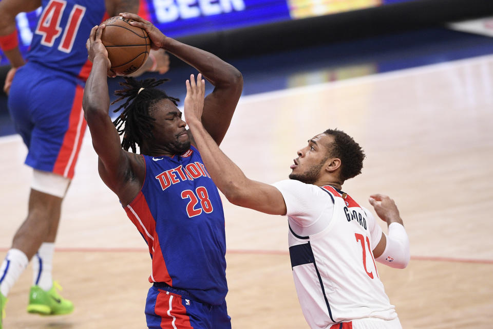 Detroit Pistons center Isaiah Stewart (28) keeps the ball away from Washington Wizards center Daniel Gafford (21) during the first half of an NBA basketball game, Saturday, April 17, 2021, in Washington. (AP Photo/Nick Wass)