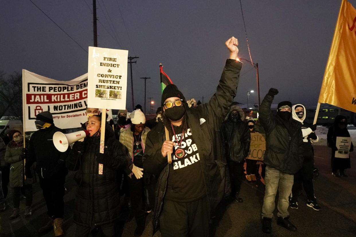 Justin Blake, uncle of Jacob Blake, leads a march Monday, Jan. 4, 2021, in Kenosha, Wis. Kenosha Police Officer Rusten Sheskey opened fire on Jacob Blake in August after responding to a domestic dispute, leaving him paralyzed. (AP Photo/Morry Gash)