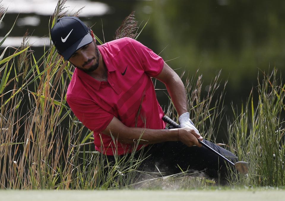 Abraham Ancer fails on his first attempt to hit out of the rough on the second green during the final round of the Dell Technologies Championship golf tournament at TPC Boston in Norton, Mass., Monday, Sept. 3, 2018. (AP Photo/Michael Dwyer)