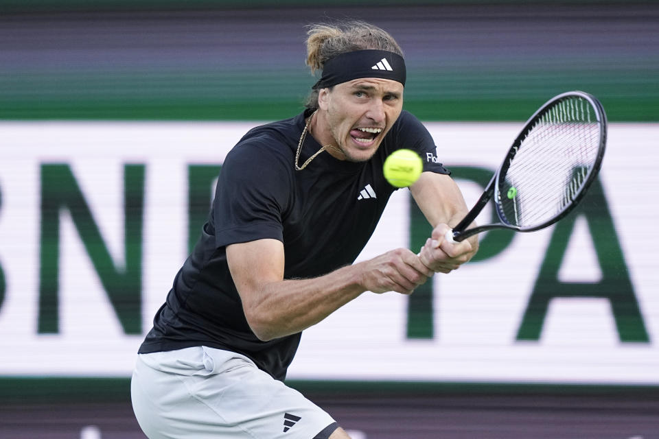 Alexander Zverev, of Germany, returns to Carlos Alcaraz, of Spain, during a quarterfinal match at the BNP Paribas Open tennis tournament, Thursday, March 14, 2024, in Indian Wells, Calif. (AP Photo/Mark J. Terrill)