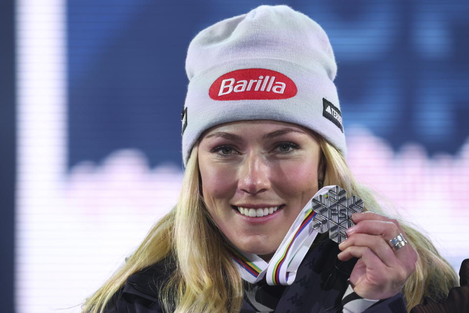 United States' Mikaela Shiffrin shows the gold medal of the alpine ski, women's World Championship super-G race, in Meribel, France, Wednesday, Feb. 8, 2023. (AP Photo/Alessandro Trovati)