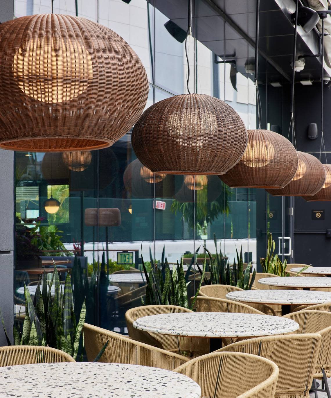 Outdoor tables on the patio at Joey in Aventura. Juan Botero