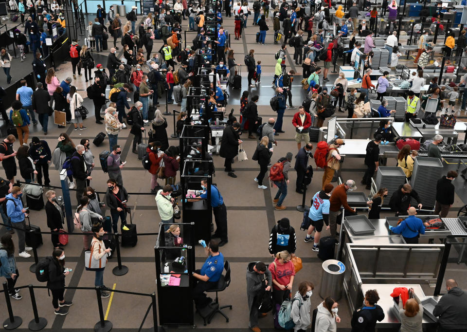 Long lines of travelers making their way through TSA security at Denver International Airport the day before Thanksgiving in 2021. (RJ Sangosti / Denver Post via Getty Images file)