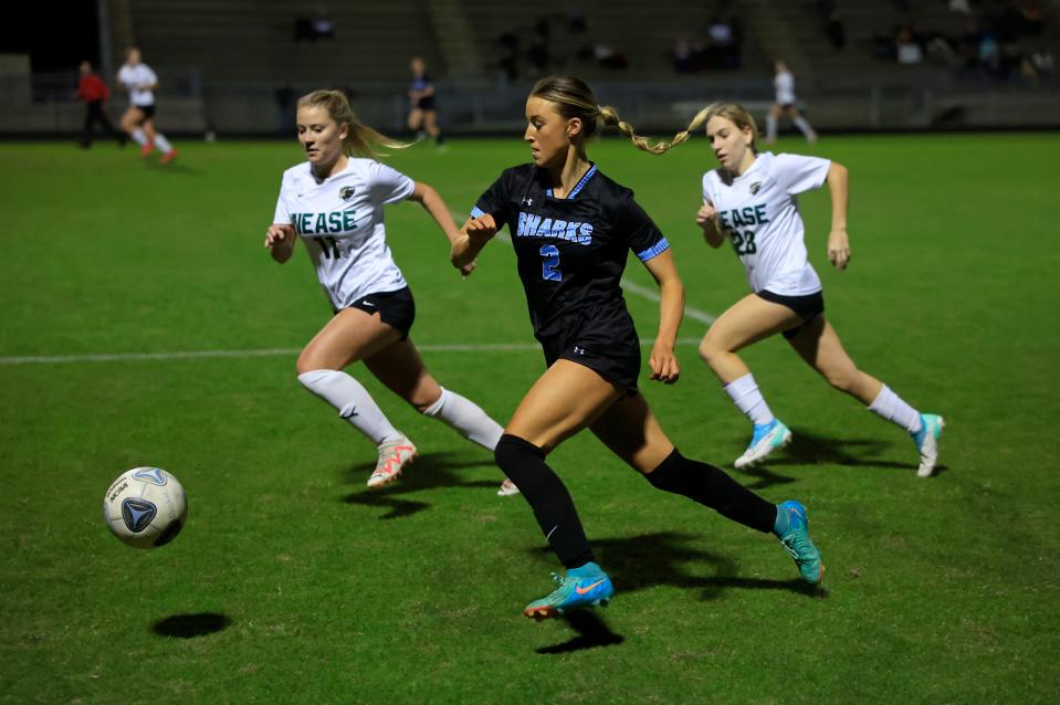 Ponte Vedra's Natalie Brooks (2) dribbles the ball against Nease’s Samantha Akers (11) and Samantha Grehl (28) during the first half of the District 3-6A final.