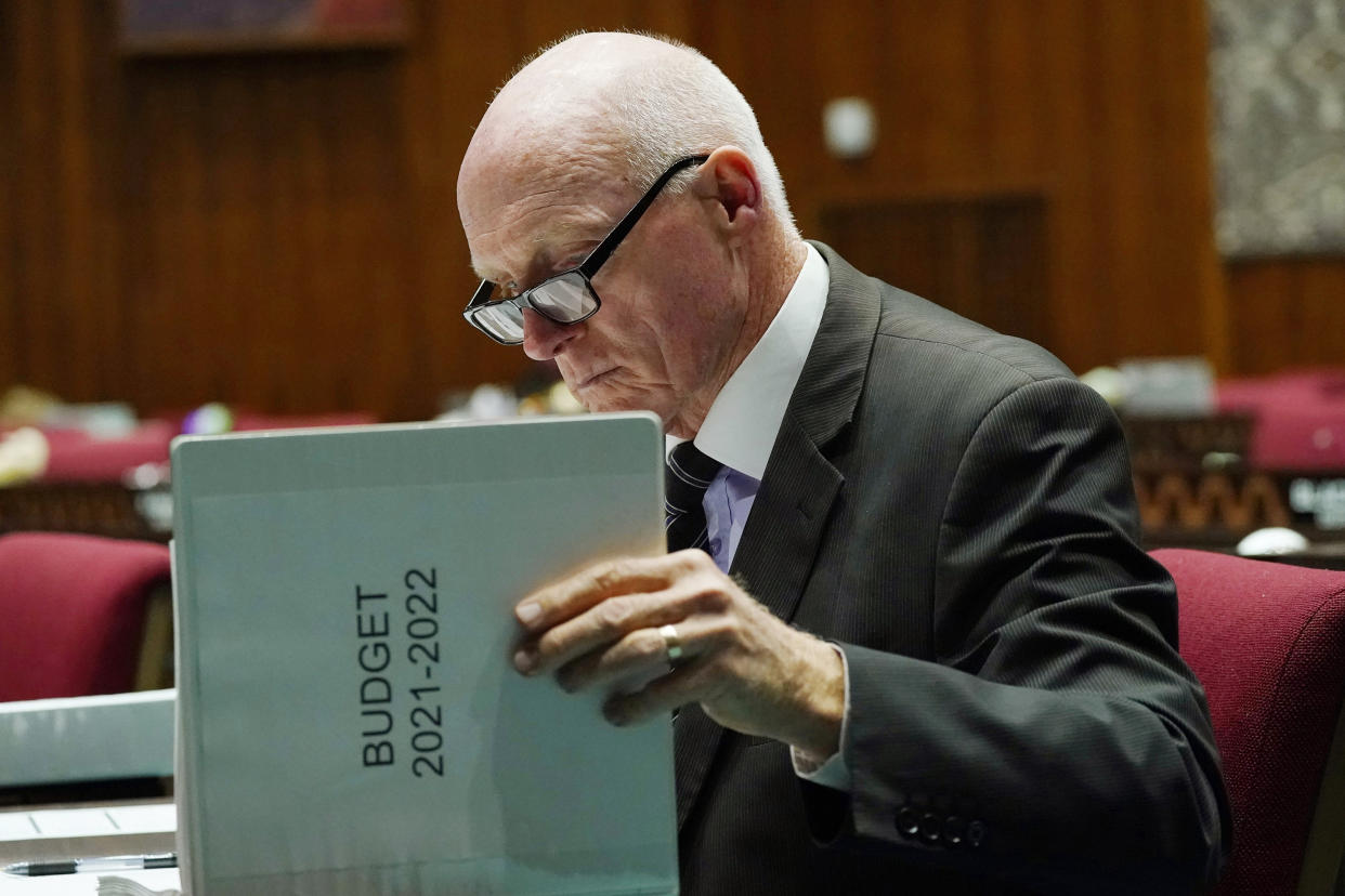 Arizona House Speaker Rusty Bowers, R-Mesa, looks over the printed budget prior to a vote on the Arizona budget at the Arizona Capitol Thursday, June 24, 2021, in Phoenix. (AP Photo/Ross D. Franklin)