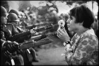 <p>An American young girl, Jan Rose Kasmir, confronts the American National Guard outside the Pentagon during the 1967 anti-Vietnam march om Washington, D.C. This march helped to turn public opinion against the U.S. war in Vietnam. (© Marc Riboud/Magnum Photos) </p>