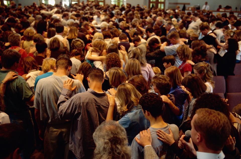 Students gather at the Light of the World Catholic Church for a memorial service honoring the victims of the Columbine High School shooting.