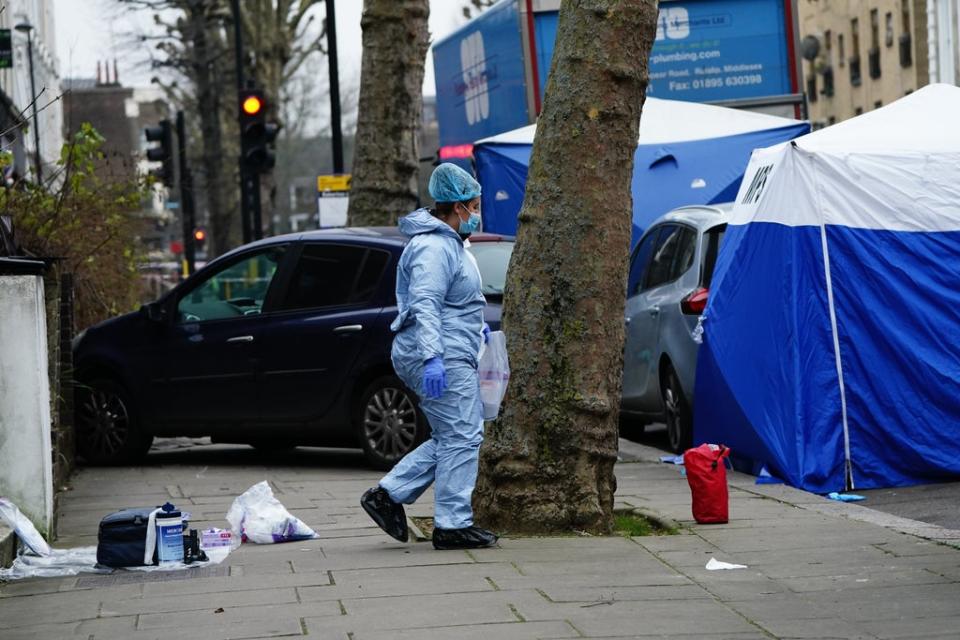 Police working at the scene of the deaths in Maida Vale, west London on Monday (Aaron Chown/PA) (PA Wire)
