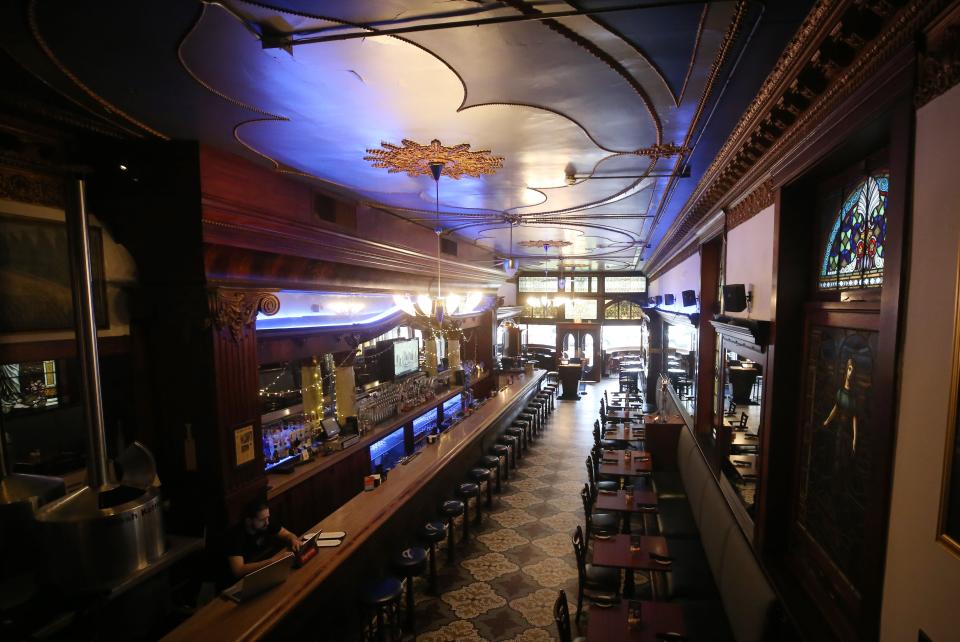 This is a view of the bar at the Elevator Brewery & Draught Haus in Columbus. The mahogany bar predates the building, which was built in 1897. The bar was built in 1893 for entry in the Chicago World's Fair.