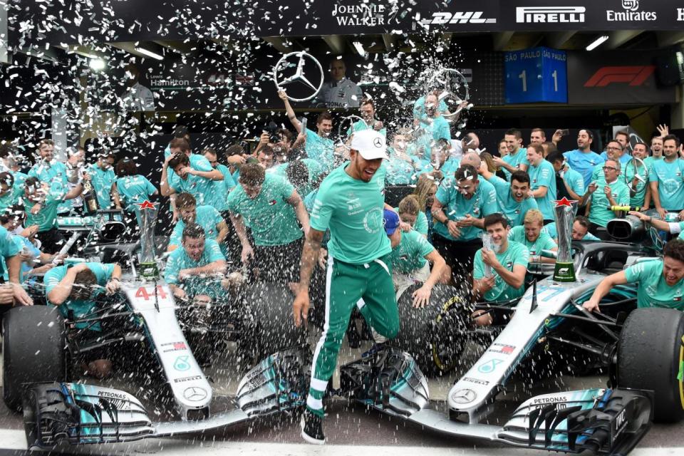 Lewis Hamilton and Mercedes team celebrate after their team won the F1 on November 11, 2018. (Getty Images)