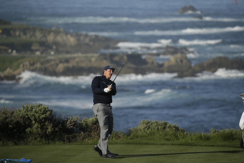 Phil Mickelson follows his shot from the fourth tee of the Spyglass Hill Golf Course during the first round of the AT&T Pebble Beach National Pro-Am golf tournament Thursday, Feb. 6, 2020, in Pebble Beach, Calif. (AP Photo/Eric Risberg)