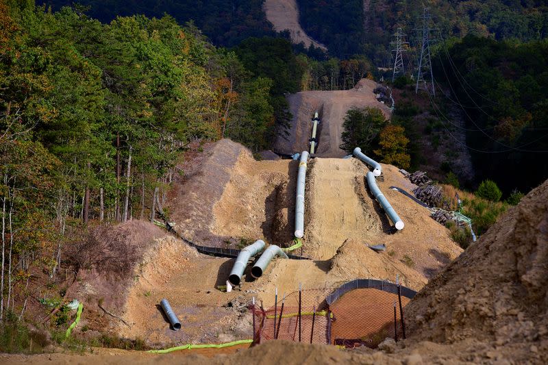 Lengths of pipe wait to be laid in the ground along the under-construction Mountain Valley Pipeline near Elliston