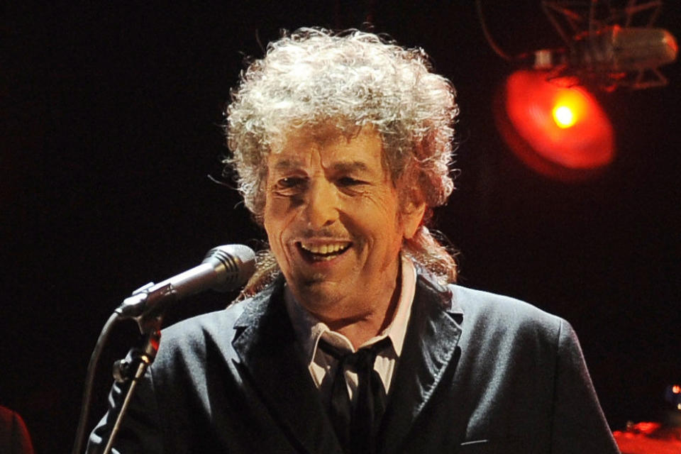 FILE - Bob Dylan performs in Los Angeles, Jan. 12, 2012. The Nobel Prize-winning songwriter in 2020 sold publishing rights to his catalog of more than 600 songs to the Universal Music Publishing Group. The singer’s collection includes modern standards like “Blowin’ in the Wind” and “Like a Rolling Stone.” Industry experts estimated the deal was in the range of $300 million to a half-billion dollars. (AP Photo/Chris Pizzello, File)