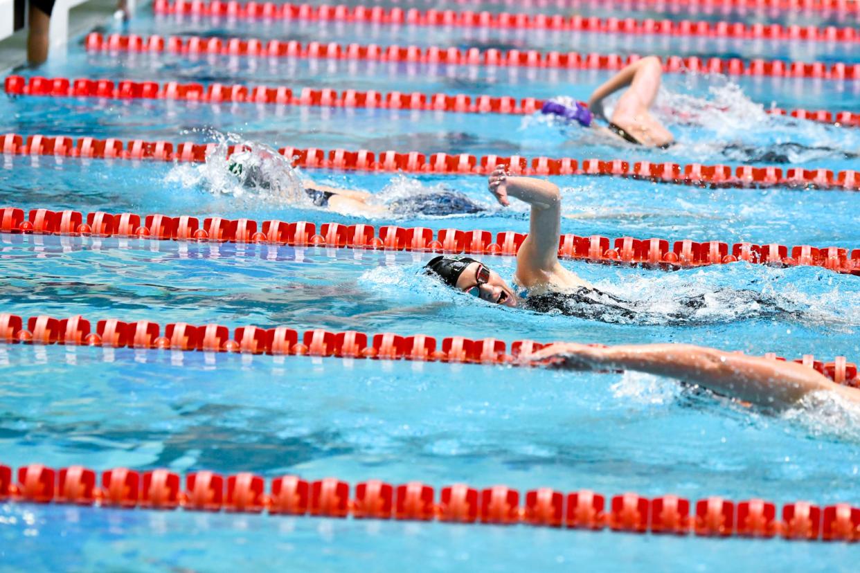 Pueblo County's Maggie Jagger battles a tight-knit 500-yard freestyle at the CHSAA 3A state swim championships in 2020.