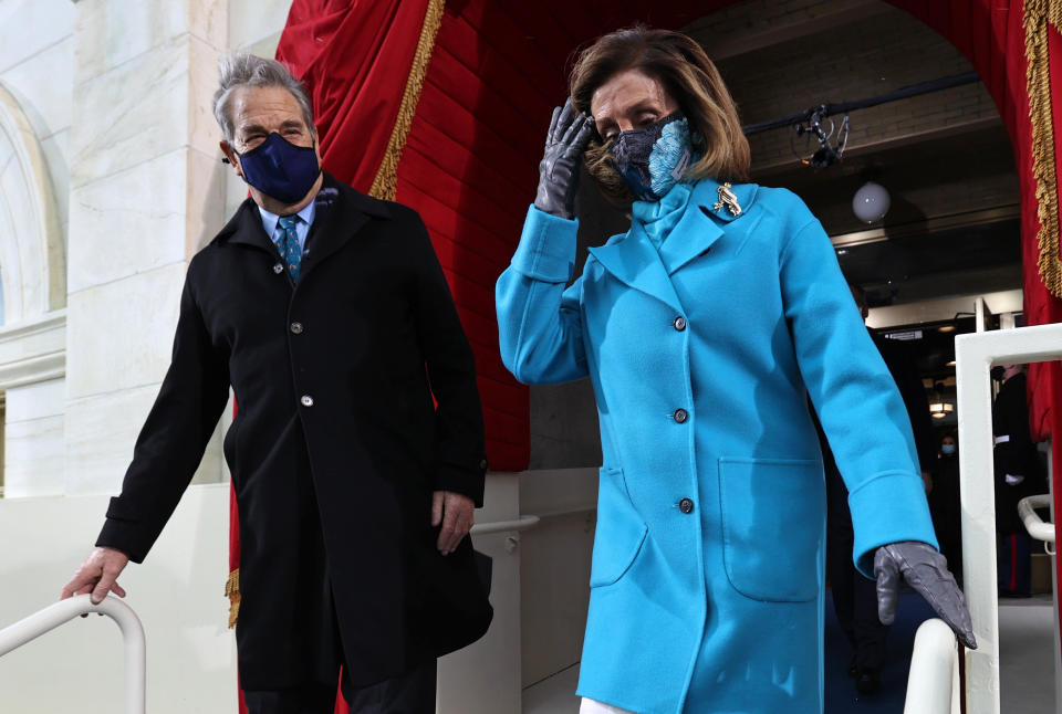 Speaker of the House Nancy Pelosi arrives with her husband Paul Pelosi during the inauguration of Joe Biden as the 46th President of the United States on the West Front of the US Capitol in Washington DC on January 20, 2021. (Photo by JONATHAN ERNST / POOL / AFP) (Photo by JONATHAN ERNST/POOL/AFP via Getty Images)