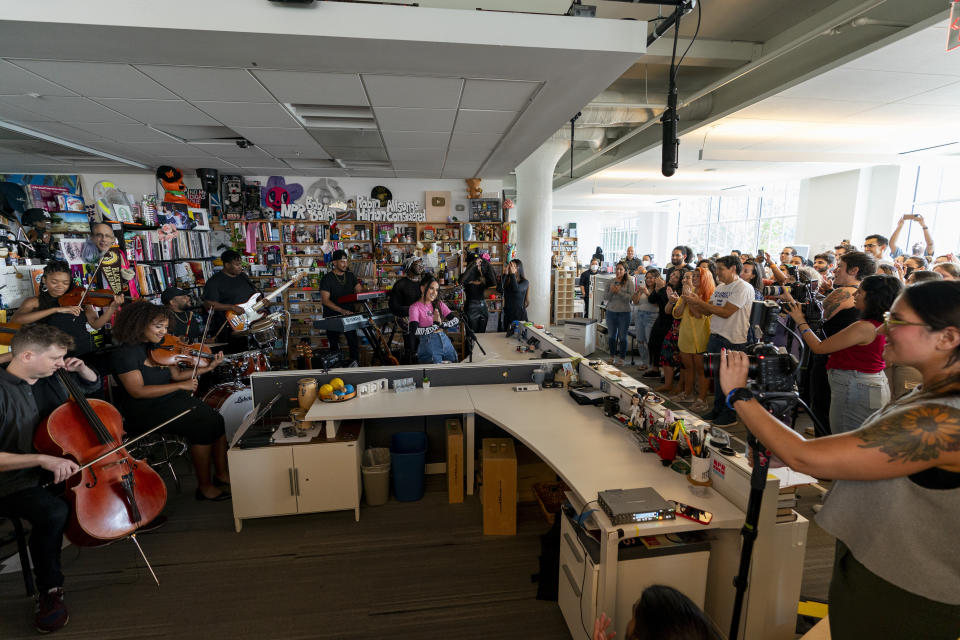 An audience watches while Becky G performs during a taping for NPR's Tiny Desk concert series on Wednesday, Aug. 30, 2023, in Washington. (AP Photo/Stephanie Scarbrough)