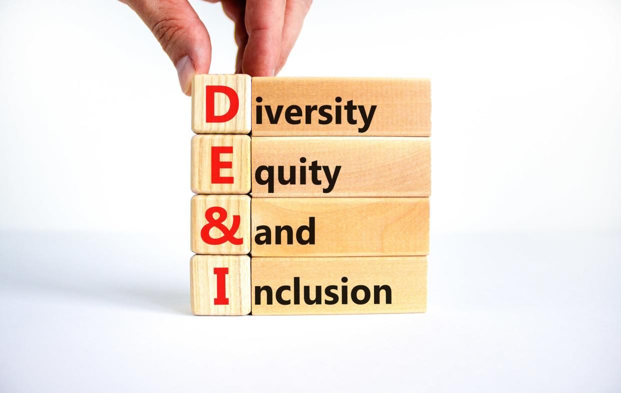 DEI, diversity, equity and inclusion on wooden cubes