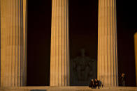 <p>Visitors sit at the Lincoln Memorial at sunrise in Washington on Saturday, Jan. 20, 2018. The U.S. government officially entered a partial shutdown early Saturday. (Photo: Andrew Harrer/Bloomberg via Getty Images) </p>