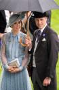 <p>On the first day of Royal Ascot, Prince William helpfully shields his wife from the downpour.</p>