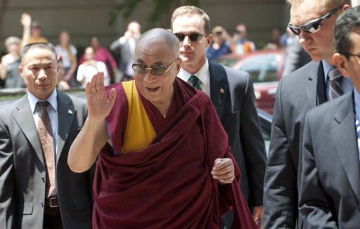 The Dalai Lama arrives at his hotel in Washington. The Tibetan spiritual leader opened a visit to Washington to deliver spiritual teachings, with a legislative aide saying he will meet top members of the US Congress