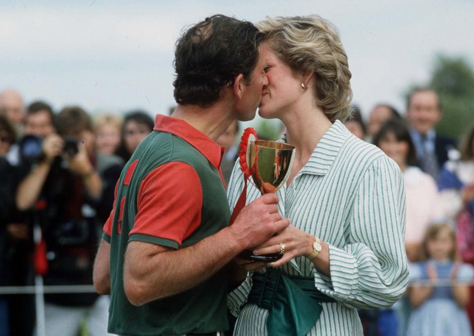 <p>A classic everyday jewelry pairing, Diana wore a gold watch and gold hoops to support Prince Charles at a 1985 charity polo match. </p>