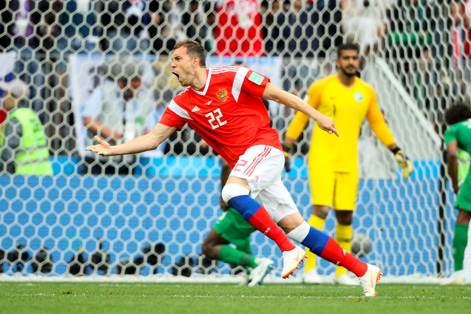 <p>Artem Dzyuba of Russia celebrates after scoring his sides third goal during the 2018 FIFA World Cup Russia group A match between Russia and Saudi Arabia at Luzhniki Stadium on June 14, 2018 in Moscow, Russia. (Getty Images) </p>