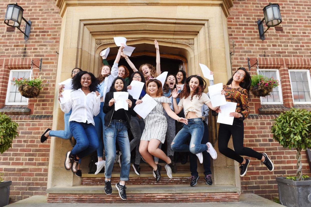 Delighted: Students celebrate A-level results but they may find the clearing process stressful: PA