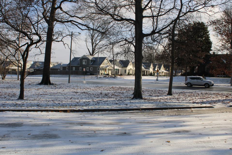 Snow blanketed Eastern Parkway near Overton Park in Memphis on Friday, Dec. 23, 2022. A cold front brought single digit temperatures and icy conditions to the area.