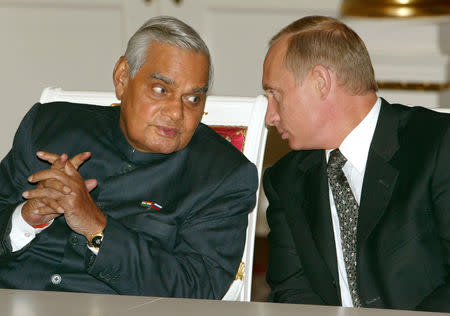 FILE PHOTO: Russian President Vladimir Putin (R) speaks with Indian Prime Minister Atal Bihari Vajpayee during a signing ceremony in Moscow's Kremlin, Russia November 12, 2003. Mikhail Metzel/Pool via Reuters/File Photo