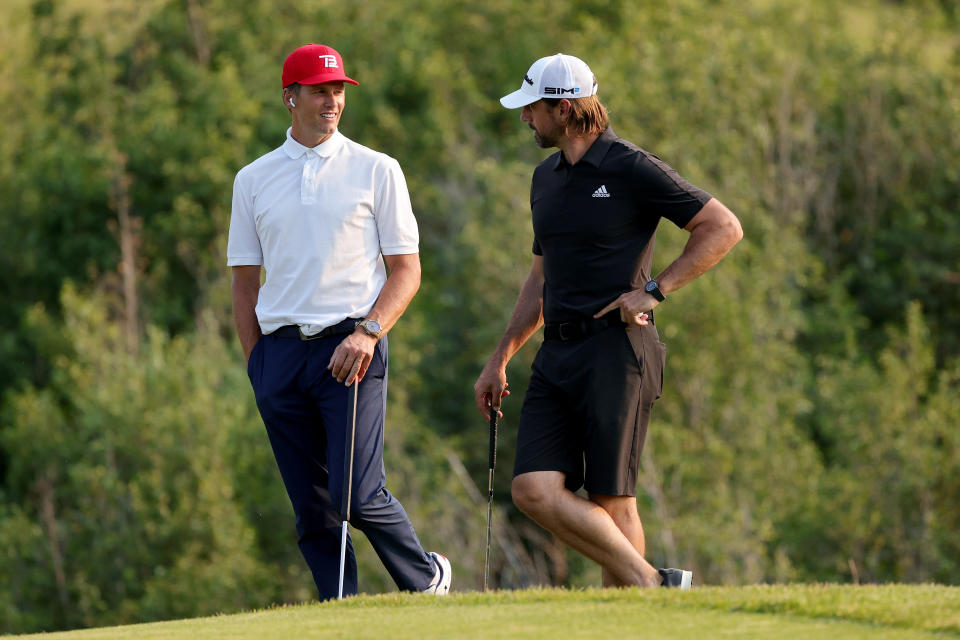 Tom Brady and Aaron Rodgers meet during Capital One’s The Match at The Reserve at Moonlight Basin on July 06, 2021 in Big Sky, Montana. (Photo by Stacy Revere/Getty Images for The Match)