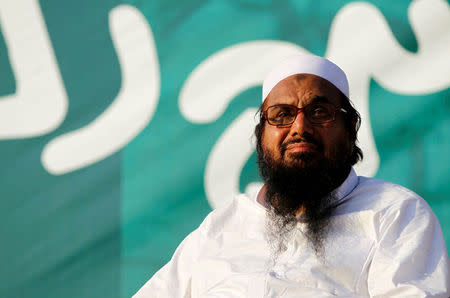 Hafiz Muhammad Saeed, chief of the banned Islamic charity Jamat-ud-Dawa, looks over the crowed as they end a "Kashmir Caravan" from Lahore with a protest in Islamabad, Pakistan July 20, 2016. REUTERS/Caren Firouz