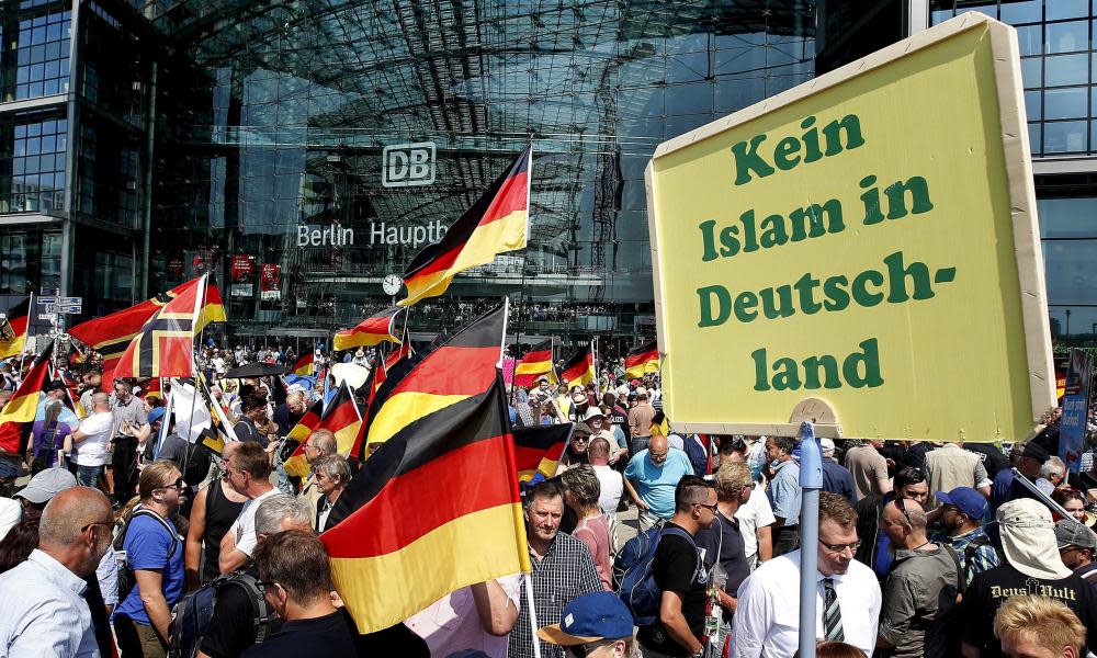 Supporters of German AfD wave flags in front of the train station in Berlin