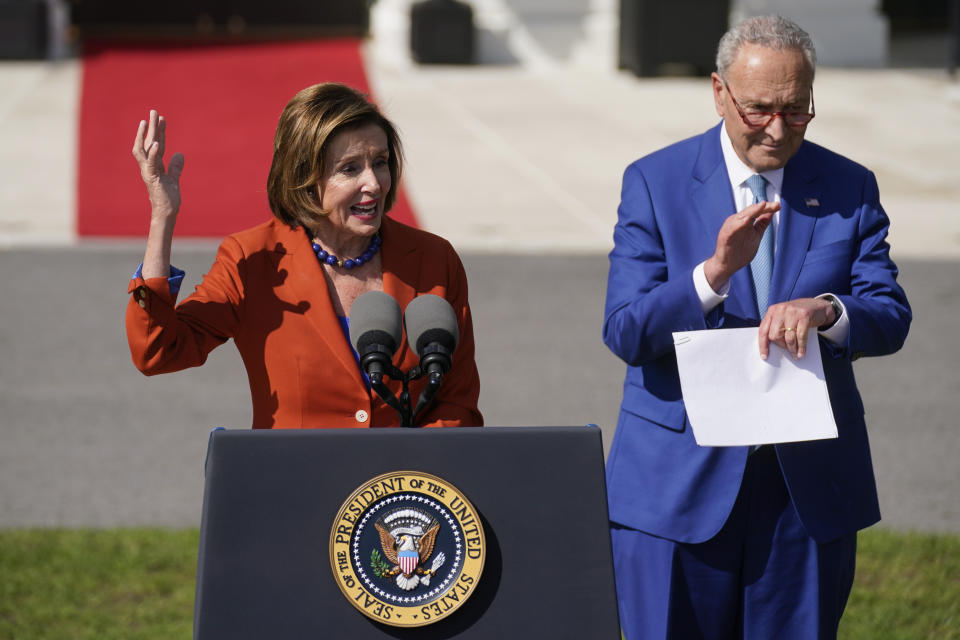 Senate Majority Leader Chuck Schumer of N.Y., listens as House Speaker Nancy Pelosi of Calif., speaks during an event about the Inflation Reduction Act of 2022, on the South Lawn of the White House in Washington, Tuesday, Sept. 13, 2022. (AP Photo/Andrew Harnik)