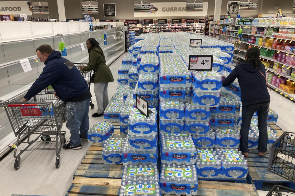 Shoppers stock up on bottle water following a chemical spill into the Delaware River upstream from Philadelphia, Tuesday, March 28, 2023. Health officials in Bucks County, just north of Philadelphia, said Sunday that thousands of gallons of a water-based latex finishing solution spilled into the river late Friday due to a leak at the Trinseo Altuglas chemical facility in Bristol Township. (AP Photo/Matt Rourke)