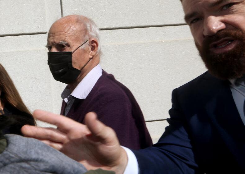 LOS ANGELES, CALIF. - FEB. 6, 2023. Tom Girardi, left, arrives for an initial court appearance at the Edward Roybal Federal Court Building in Los Angeles on Monday, Feb. 6, 2023, after being indicted by a federal grand jury for allegedly embezzling more than $15 million from several of his legal clients. (Luis Sinco / Los Angeles Times)