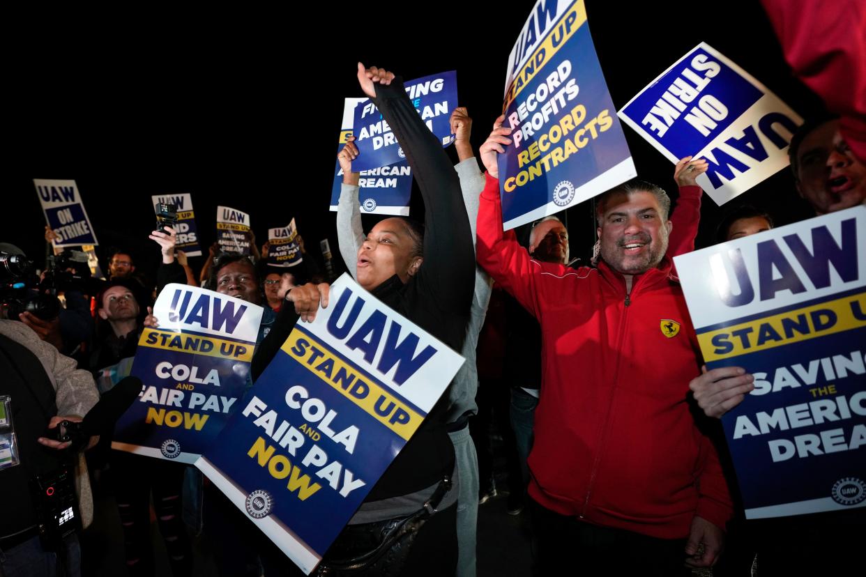 Striking United Auto Workers picket at Ford's Michigan Assembly Plant in Wayne, Mich., shortly after midnight Friday.