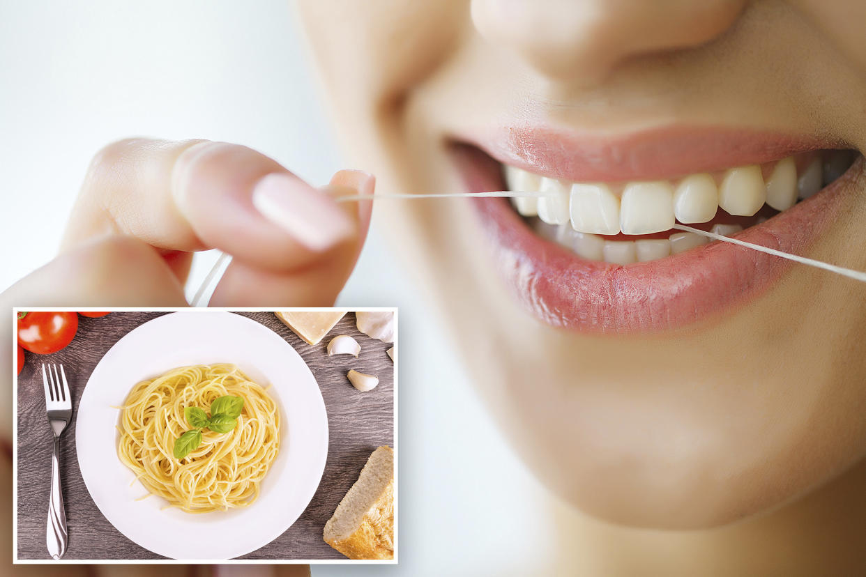 Woman flossing teeth with beautiful smile.