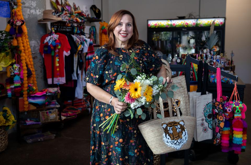 Miriam "Mili" Cordero owns Mili's Flowers and Gifts on Tuesday, Oct. 4, 2022, at Crosstown Concourse in Memphis. Patrons of the store can create their own flower bouquets as well as shop for various Mexican-made items. 