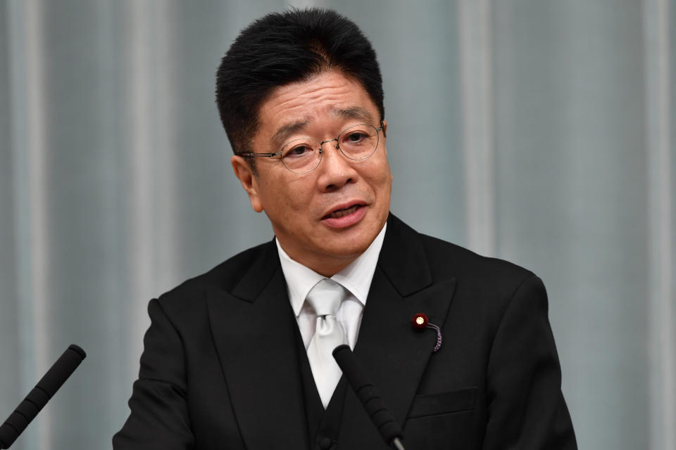 Newly appointed Japanese Health, Labour and Welfare Minister Katsunobu Kato speaks during a press conference at the prime minister's official residence in Tokyo on September 11, 2019. - Japan's Prime Minister Shinzo Abe on September 11 appointed new foreign and defence ministers and promoted a popular rising political star, in a cabinet reshuffle that fuelled speculation over the prime minister's successor. (Photo by Toshifumi KITAMURA / AFP)        (Photo credit should read TOSHIFUMI KITAMURA/AFP via Getty Images)