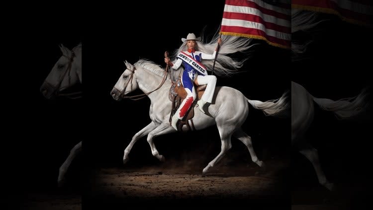 A person riding a horse with a flag Description automatically generated