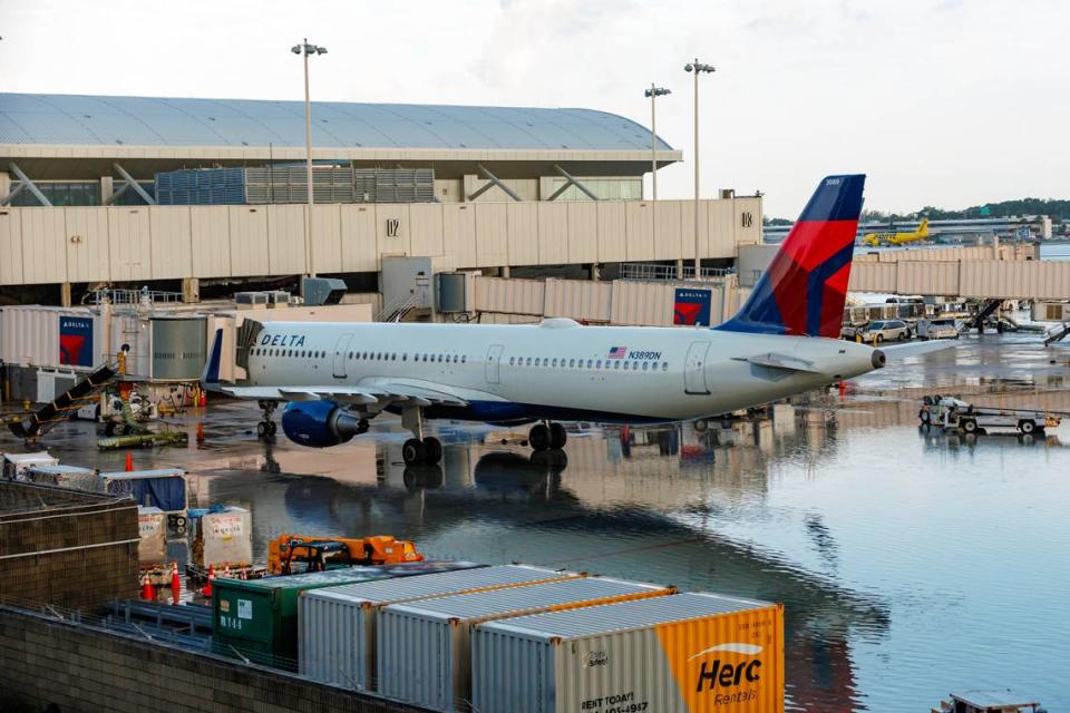 A Delta Air Lines jet at the terminal as the runway remains flooded from heavy rain at Fort Lauderdale-Hollywood International Airport on Thursday, April 13, 2023.